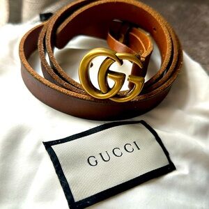 Gucci leather belt with two G’s.
